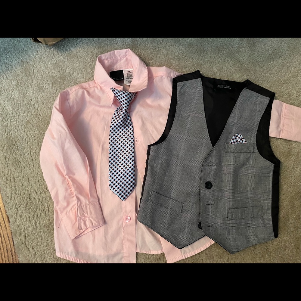 Pink dress shirt with vest and tie.